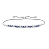 Thumbnail Image 1 of Lab-Created Blue Sapphire and 1/15 CT. T.W. Diamond Three Stone "X" and "O" Bolo Bracelet in Sterling Silver - 9.5"