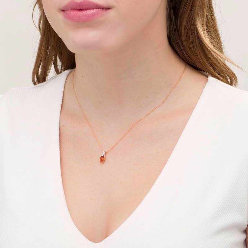 Main Image 2 of Oval Madeira Citrine and 1/20 CT. T.W. Diamond "X" Drop Pendant in 10K Gold