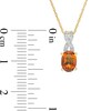 Thumbnail Image 3 of Oval Madeira Citrine and 1/20 CT. T.W. Diamond "X" Drop Pendant in 10K Gold
