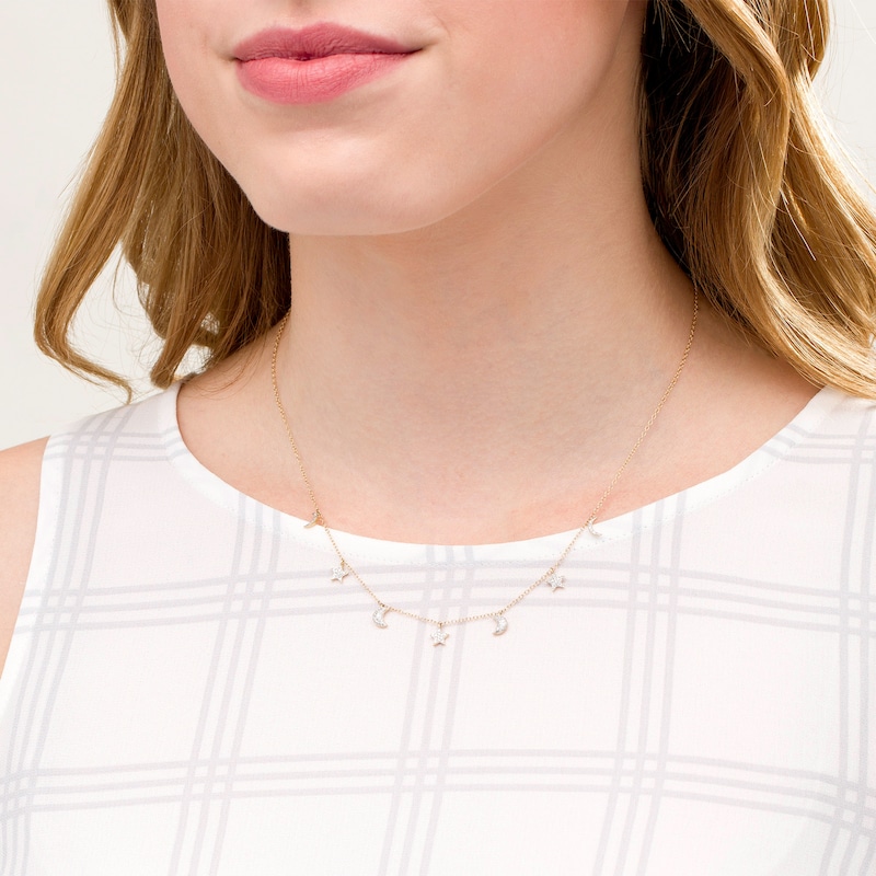 Main Image 2 of 1/6 CT. T.W. Diamond Crescent Moon and Star Station Necklace in 10K Gold - 19"