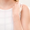 Thumbnail Image 2 of 1/20 CT. T.W. Diamond Alternating Star Charm Bracelet in 10K White Gold - 7.5"