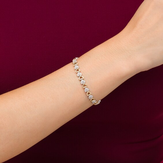 1/10 CT. T.w. Diamond Sideways Heart Link Bracelet in Sterling Silver and 10K Gold â 7.25"