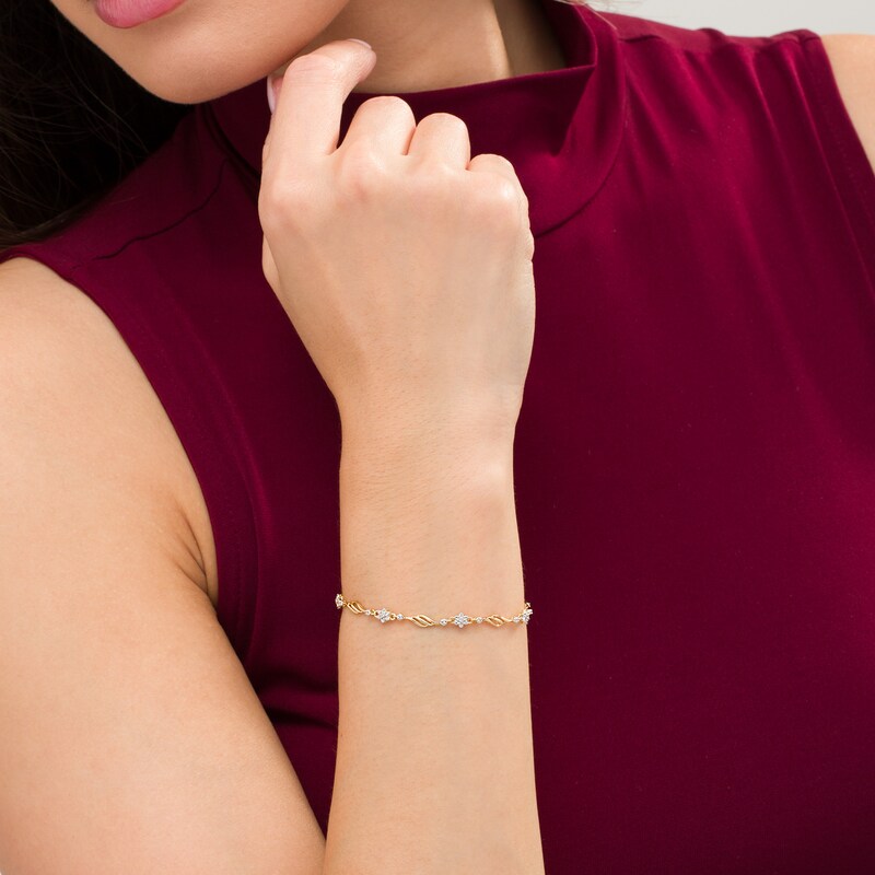 Main Image 2 of 1/10 CT. T.W. Diamond Alternating Flower Bracelet in 10K Gold – 7.5"