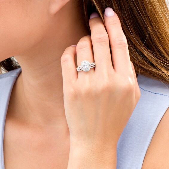 1 CT. T.w. Diamond Double Oval Frame Twist Shank Bridal Set in 10K White Gold