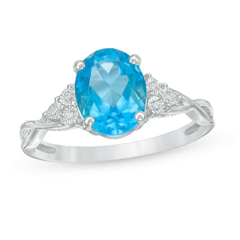 Main Image 1 of Oval Blue Topaz and Diamond Accent Tri-Sides Twist Shank Ring in Sterling Silver