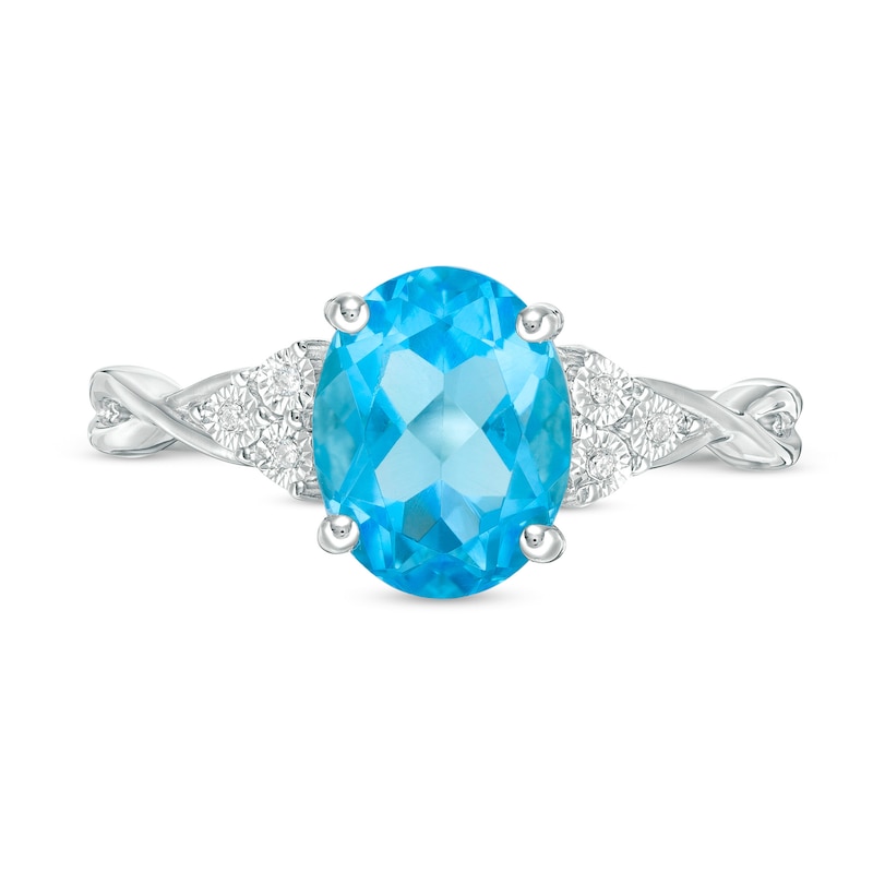 Oval Blue Topaz and Diamond Accent Tri-Sides Twist Shank Ring in Sterling Silver