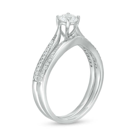 4.5mm Lab-Created White Sapphire and 1/8 CT. T.w. Diamond Waves Bridal Set in 10K White Gold