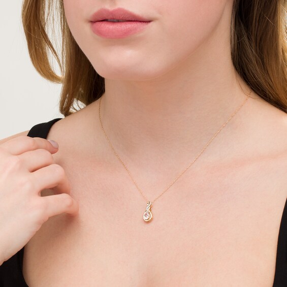 Pear-Shaped Lab-Created White Sapphire and Diamond Accent Cascading Teardrop Pendant in 10K Gold Pear-Shaped Lab-Created White Sapphire and Diamond Accent Cascading Teardrop Pendant in 10K Gold