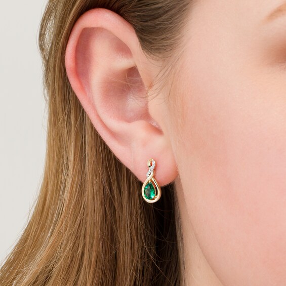Pear-Shaped Lab-Created Emerald and 1/20 CT. T.W. Diamond Cascading Teardrop Earrings in 10K Gold Pear-Shaped Lab-Created Emerald and 1/20 CT. T.W. Diamond Cascading Teardrop Earrings in 10K Gold