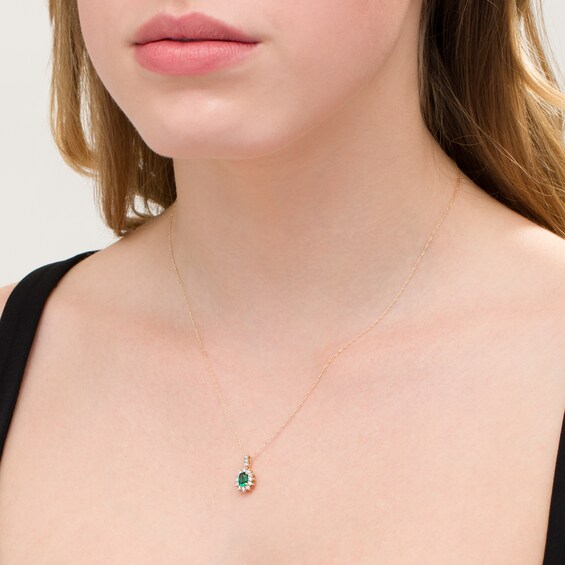 Oval Lab-Created Emerald and 1/5 CT. T.W. Diamond Starburst Frame Pendant in 10K Gold Oval Lab-Created Emerald and 1/5 CT. T.W. Diamond Starburst Frame Pendant in 10K Gold