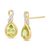 Thumbnail Image 0 of Pear-Shaped Lab-Created Peridot and 1/20 CT. T.W. Diamond Cascading Teardrop Earrings in 10K Gold