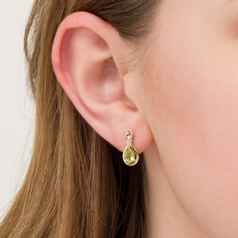 Pear-Shaped Lab-Created Peridot and 1/20 CT. T.W. Diamond Cascading Teardrop Earrings in 10K Gold