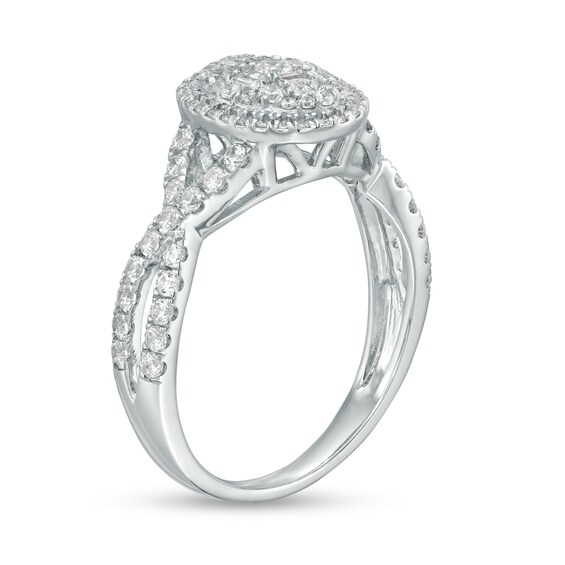 1 CT. T.w. Baguette and Round Diamond Oval Frame Twist Shank Ring in 10K White Gold