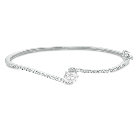Sideways Oval Lab-Created White Sapphire and 1/20 CT. T.w. Diamond Bypass Bangle in Sterling Silver