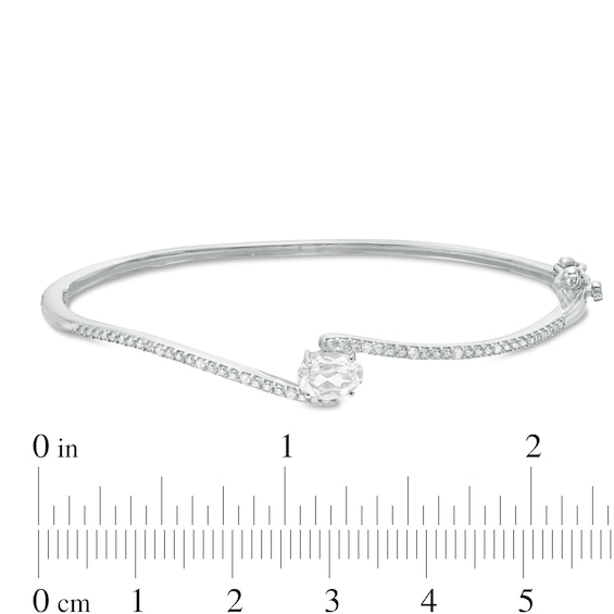 Sideways Oval Lab-Created White Sapphire and 1/20 CT. T.w. Diamond Bypass Bangle in Sterling Silver
