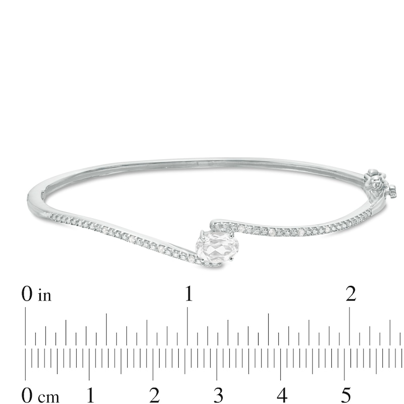 Sideways Oval Lab-Created White Sapphire and 1/20 CT. T.W. Diamond Bypass Bangle in Sterling Silver