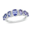 Thumbnail Image 0 of Oval Tanzanite and 1/6 CT. T.W. Diamond Graduated Seven Stone Ring in 10K White Gold