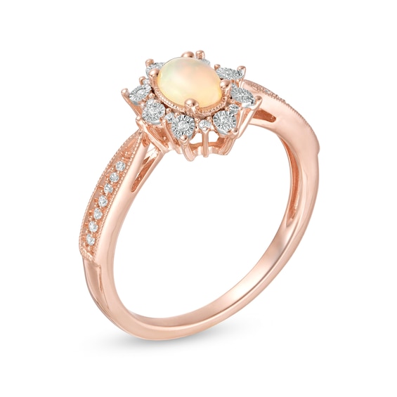 Oval Opal and 1/10 CT. T.W. Diamond Sunburst Frame Vintage-Style Tapered Shank Ring in 10K Rose Gold Oval Opal and 1/10 CT. T.W. Diamond Sunburst Frame Vintage-Style Tapered Shank Ring in 10K Rose Gold