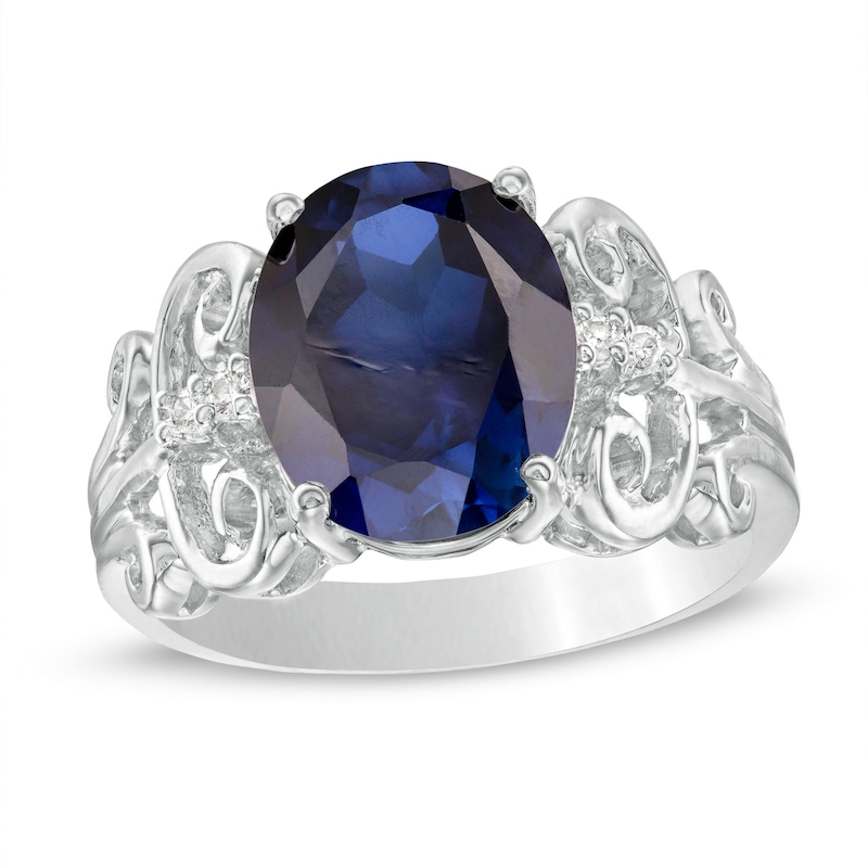 Main Image 1 of Oval Lab-Created Blue Sapphire and 1/20 CT. T.W. Diamond Vintage-Style Scroll Ring in 10K White Gold