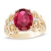 Thumbnail Image 0 of Oval Lab-Created Ruby and 1/20 CT. T.W. Diamond Vintage-Style Scroll Ring in 10K Gold