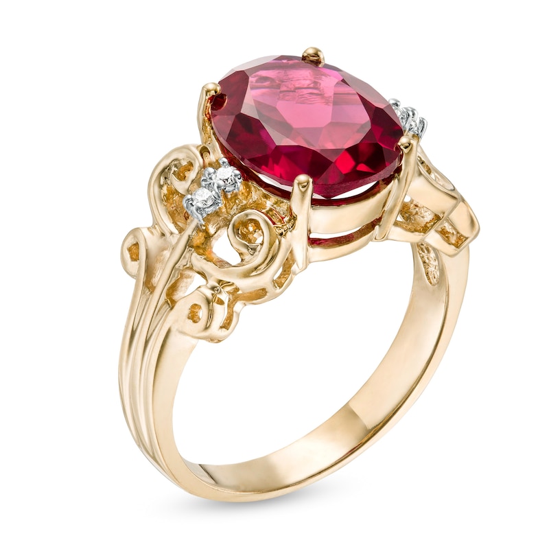 Oval Lab-Created Ruby and 1/20 CT. T.W. Diamond Vintage-Style Scroll Ring in 10K Gold