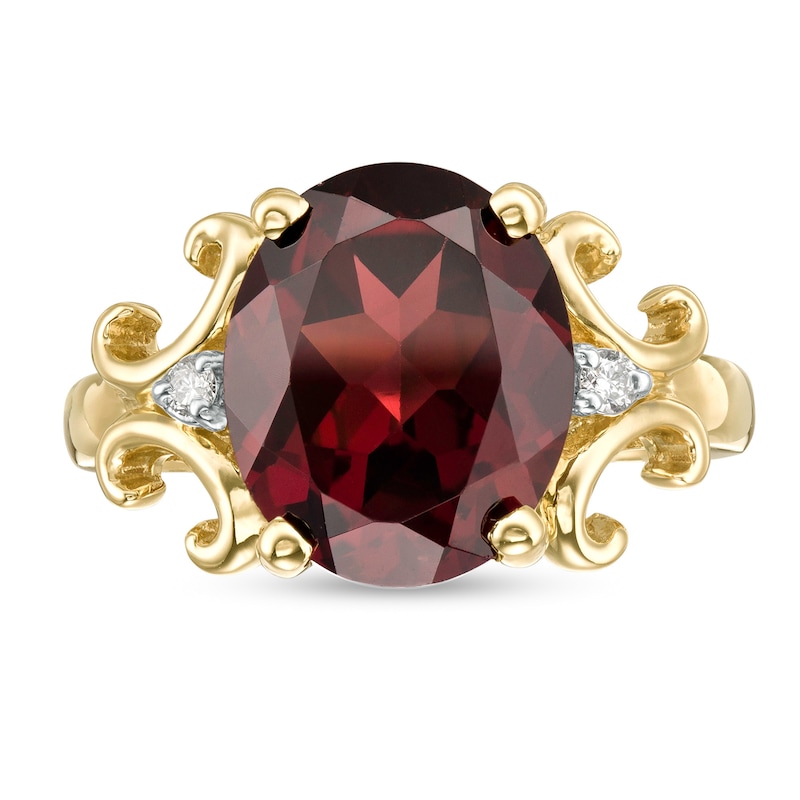 Oval Garnet and 1/20 CT. T.W. Diamond Scroll Frame Ring in 10K Gold