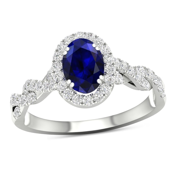 Oval Blue Sapphire and 1/3 CT. T.w. Diamond Frame Twist Shank Ring in 10K White Gold