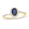 Thumbnail Image 0 of Oval Blue Sapphire and 1/8 CT. T.W. Diamond Frame Bypass Ring in 10K Gold