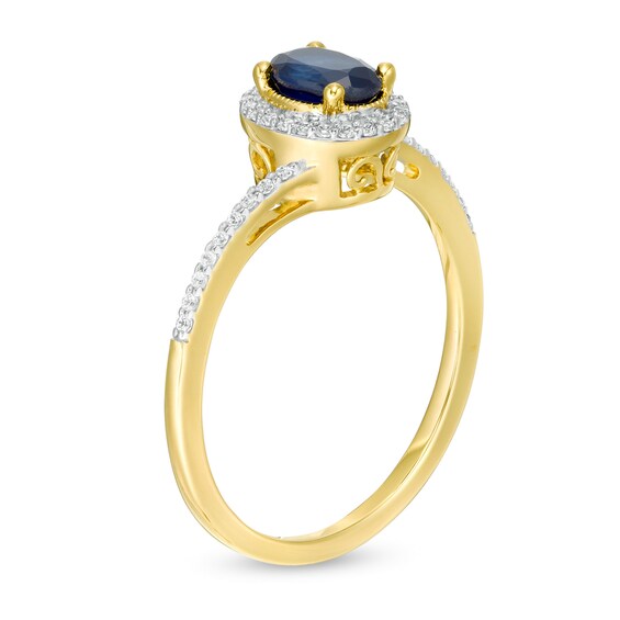 Oval Blue Sapphire and 1/8 CT. T.w. Diamond Frame Bypass Ring in 10K Gold
