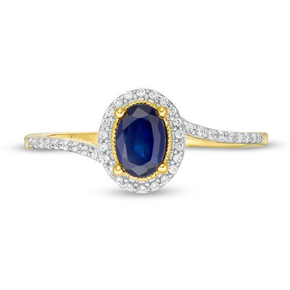 Oval Blue Sapphire and 1/8 CT. T.w. Diamond Frame Bypass Ring in 10K Gold