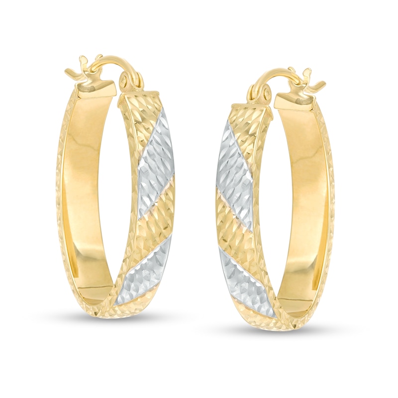 Main Image 1 of 23.0mm Diamond-Cut Striped Oval Hoop Earrings in 10K Two-Tone Gold