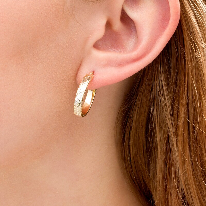 Main Image 2 of 23.0mm Diamond-Cut Striped Oval Hoop Earrings in 10K Two-Tone Gold