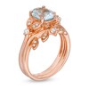 Oval Aquamarine and 1/6 CT. T.W. Diamond Vintage-Style Leaves Bridal Set in 14K Rose Gold