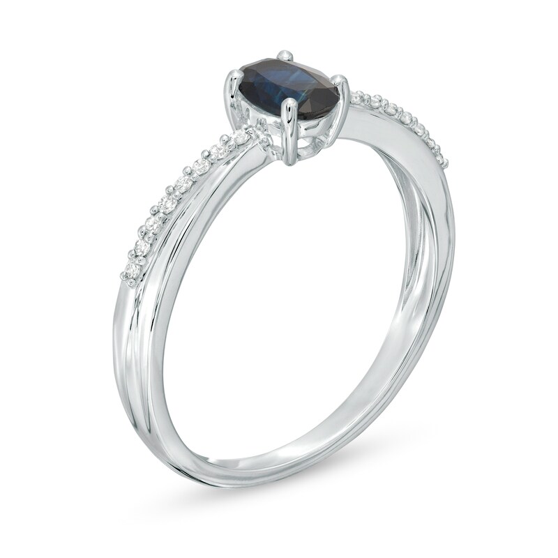 Oval Blue Sapphire and 1/15 CT. T.W. Diamond Criss-Cross Ring in 10K White Gold