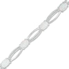 Thumbnail Image 0 of Oval Lab-Created Opal and 1/10 CT. T.W. Diamond Open Marquise Bracelet in Sterling Silver - 7.5"