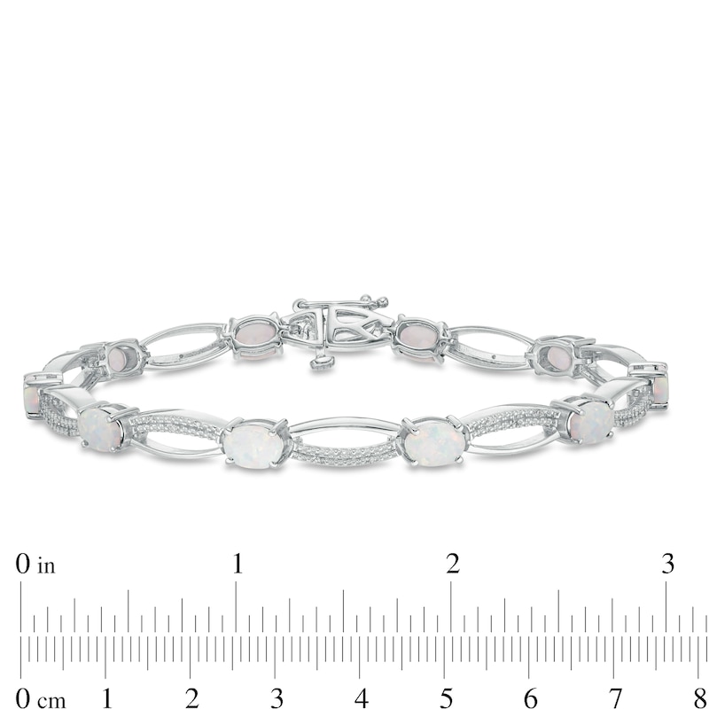 Oval Lab-Created Opal and 1/10 CT. T.W. Diamond Open Marquise Bracelet in Sterling Silver - 7.5"