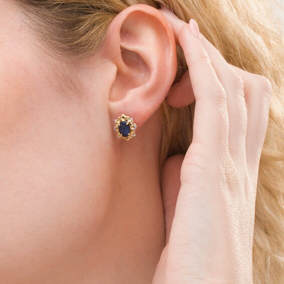 Oval Blue Sapphire and 1/15 CT. T.w. Diamond Ornate Stud Earrings in 10K Gold