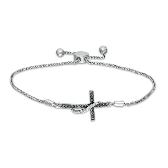 1/6 CT. T.W. Enhanced Black and White Diamond Ribbon Cross Bolo Bracelet in Sterling Silver - 9.5" 1/6 CT. T.W. Enhanced Black and White Diamond Ribbon Cross Bolo Bracelet in Sterling Silver - 9.5"