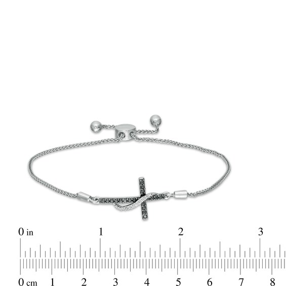 1/6 CT. T.W. Enhanced Black and White Diamond Ribbon Cross Bolo Bracelet in Sterling Silver - 9.5" 1/6 CT. T.W. Enhanced Black and White Diamond Ribbon Cross Bolo Bracelet in Sterling Silver - 9.5"