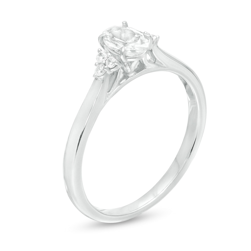 5/8 CT. T.W. Oval Diamond Tri-Sides Engagement Ring in 14K White Gold
