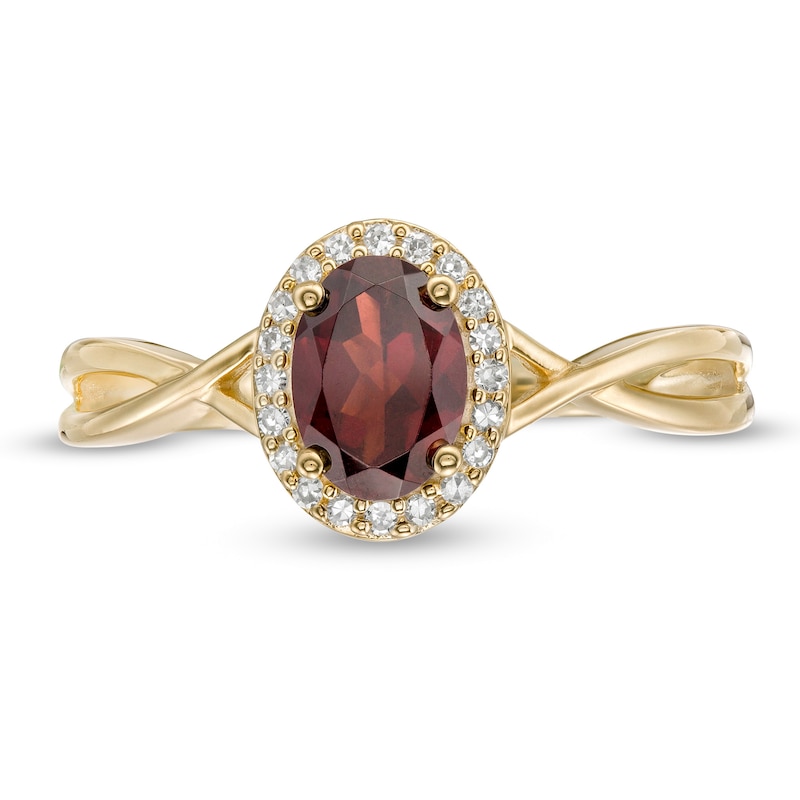 Oval Garnet and 1/15 CT. T.W. Diamond Frame Twist Shank Ring in 10K Gold