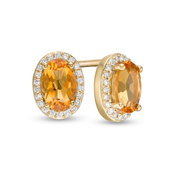 Oval Citrine and 1/10 CT. T.w. Diamond Frame Stud Earrings in 10K Gold