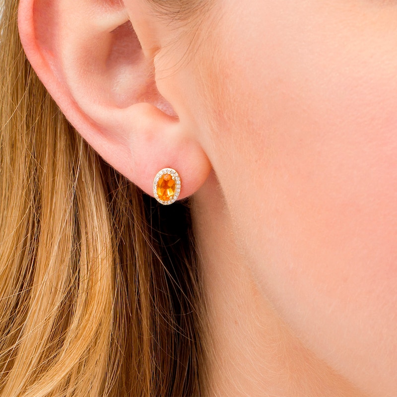 Oval Citrine and 1/10 CT. T.W. Diamond Frame Stud Earrings in 10K Gold
