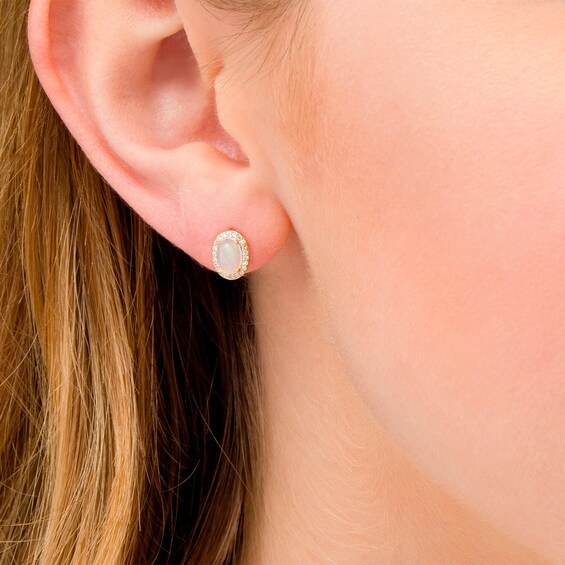 Oval Opal and 1/10 CT. T.w. Diamond Frame Stud Earrings in 10K Gold