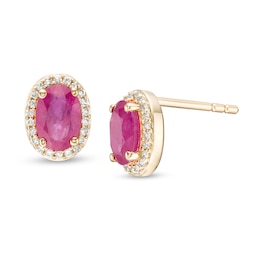 Oval Ruby and 1/10 CT. T.W. Diamond Frame Stud Earrings in 10K Gold