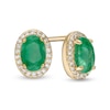 Thumbnail Image 0 of Oval Emerald and 1/10 CT. T.W. Diamond Frame Stud Earrings in 10K Gold