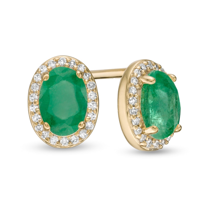Main Image 1 of Oval Emerald and 1/10 CT. T.W. Diamond Frame Stud Earrings in 10K Gold