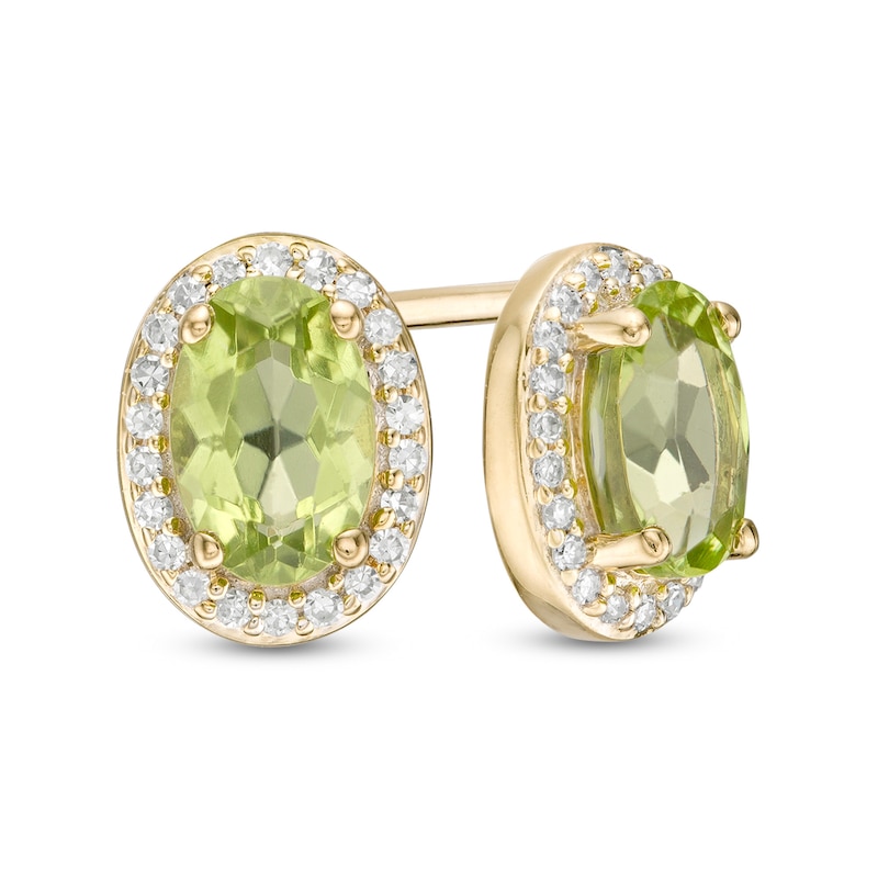 Oval Peridot and 1/10 CT. T.W. Diamond Frame Stud Earrings in 10K Gold