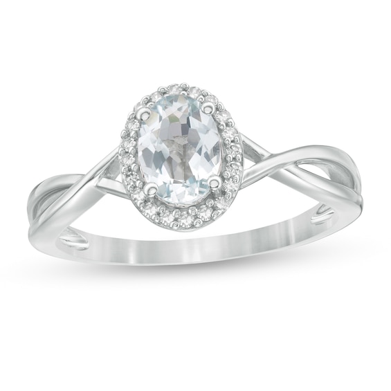 Oval Aquamarine and 1/15 CT. T.w. Diamond Frame Twist Shank Ring in 10K White Gold