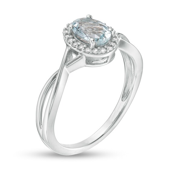 Oval Aquamarine and 1/15 CT. T.w. Diamond Frame Twist Shank Ring in 10K White Gold